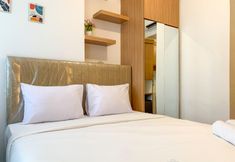 Bedroom 2 Homey and Tranquil Studio at Tokyo Riverside PIK 2 Apartment By Travelio