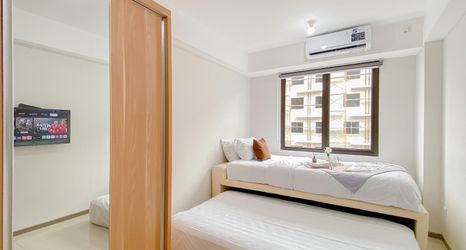 Bedroom 2 Best Deal Studio Apartment at Meikarta By Travelio