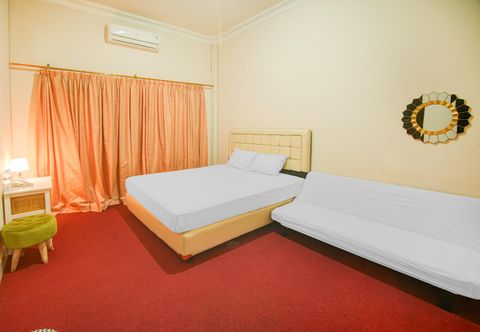 Bilik Tidur OYO 94669 Hotel Puri Inn Panakkukang Makassar