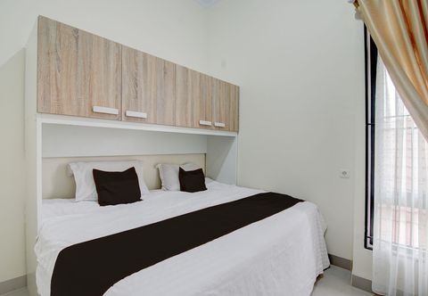 침실 OYO 94758 Kamila House