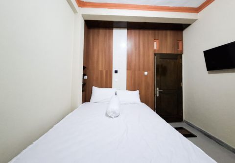 침실 Amore Guesthouse Syariah Mitra RedDoorz