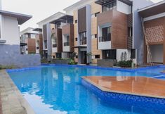 Lobby 7 Comfy and Modern Look 1BR Asatti Apartment By Travelio