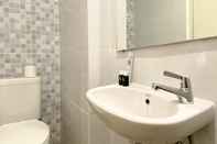 In-room Bathroom Studio Furnished with Sofa Bed at Tokyo Riverside PIK 2 Apartment By Travelio