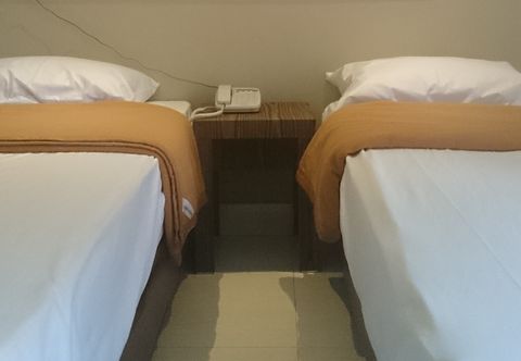 Bedroom Roemah Kita Hotel