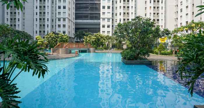 Swimming Pool 2BR with Sea View at Green Bay Pluit Apartment By Travelio
