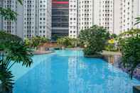 Swimming Pool 2BR with Sea View at Green Bay Pluit Apartment By Travelio