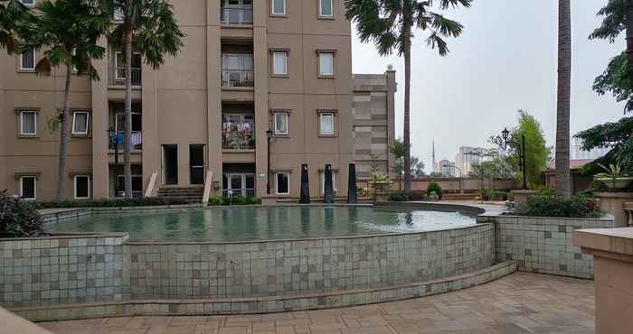 Swimming Pool Best 2BR at Grand Palace Kemayoran Apartment By Travelio