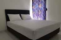 Kamar Tidur OYO 3498 Farisa Guest House