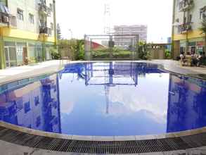 Swimming Pool 4 Relaxing and Trendy 2BR Apartment at The Suite Metro By Travelio