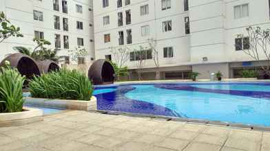 Kolam Renang 4 Cozy & Best Price 3BR at Bassura City Cipinang Apartment By Travelio