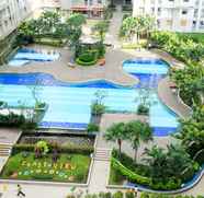 Swimming Pool 3 Homey and Posh 2BR Apartment at Green Bay Pluit By Travelio