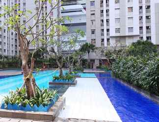 Swimming Pool 2 Homey and Posh 2BR Apartment at Green Bay Pluit By Travelio