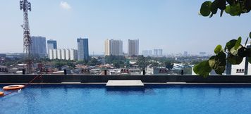 Swimming Pool 2 Cozy and Classic Studio Apartment at Tree Park City By Travelio