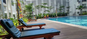 Swimming Pool 5 Homey 2BR Apartment at Signature Park Grande By Travelio