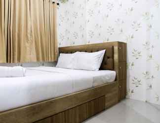 Bedroom 2 Well Furnished 2BR Green Pramuka Apartment By Travelio