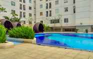 Swimming Pool 4 Comfy and Wonderful 2BR Apartment at Bassura City By Travelio