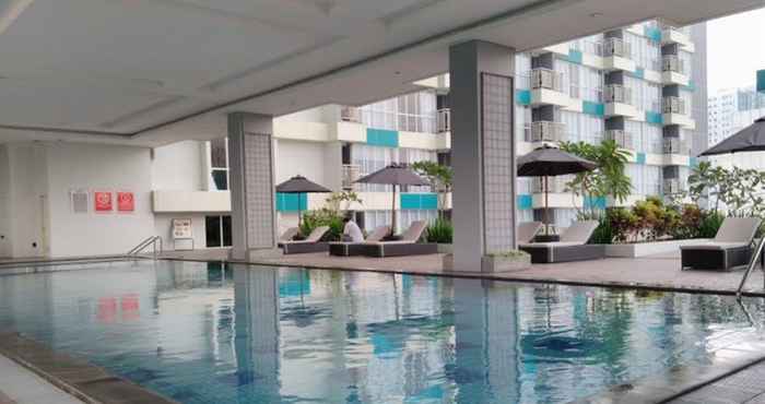 Swimming Pool Comfy Living 2BR at H Residence By Travelio
