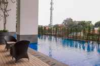 Swimming Pool Simple 2BR Apartment at Breeze Bintaro Plaza Residences By Travelio