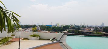 Exterior 3 Homey Studio Room at Patraland Urbano Apartment By Travelio
