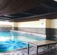 Swimming Pool 2 Trendy Studio at Tamansari La Grande Apartment By Travelio