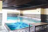 Swimming Pool Trendy Studio at Tamansari La Grande Apartment By Travelio