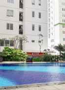 SWIMMING_POOL Homey with Beautifully Designed 2BR Bassura City Apartment By Travelio