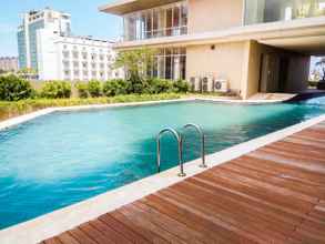 Swimming Pool 4 Furnished 2BR at Elpis Apartment By Travelio