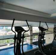 Fitness Center 3 Homey and Modern 2BR Apartment at Maqna Residence By Travelio