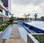 Swimming Pool 3 Comfy 2BR Apartment at Green Pramuka near Mall By Travelio