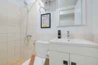 In-room Bathroom Simply Studio at Azalea Suites Cikarang Apartment By Travelio