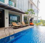 Swimming Pool 2 Cozy Living 1BR Apartment at Brooklyn Alam Sutera By Travelio