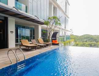 Swimming Pool 2 Cozy Living 1BR Apartment at Brooklyn Alam Sutera By Travelio