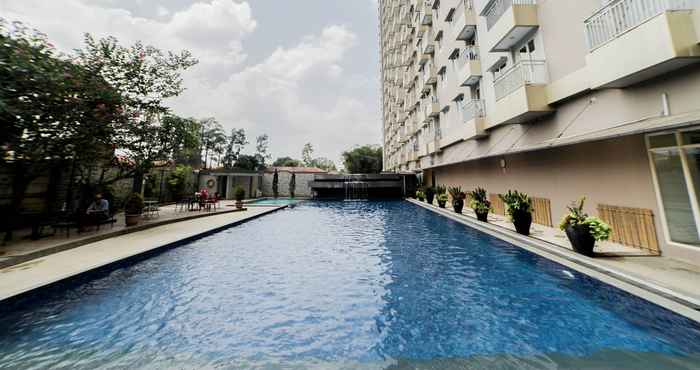 Swimming Pool Tranquil and Homey 2BR at Galeri Ciumbuleuit 2 Apartment By Travelio