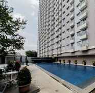 Swimming Pool 2 Tranquil and Homey 2BR at Galeri Ciumbuleuit 2 Apartment By Travelio