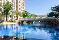 Swimming Pool Minimalist and Cozy 2BR Apartment at East Coast Residence By Travelio