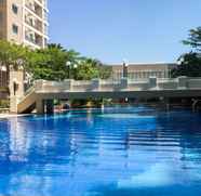 Swimming Pool 2 Minimalist and Cozy 2BR Apartment at East Coast Residence By Travelio