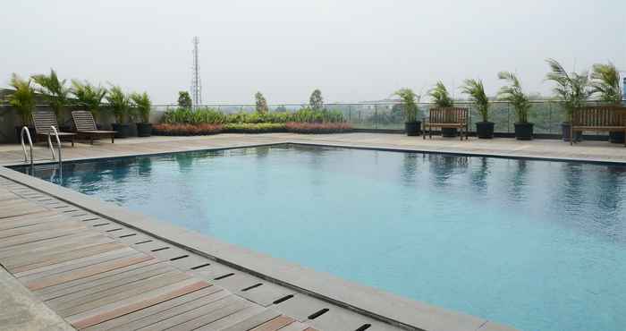 Swimming Pool Cozy Studio @ Tree Park Apartment near BSD By Travelio