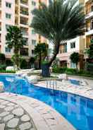 SWIMMING_POOL Homey 2BR City Home Apartment By Travelio