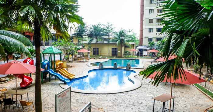 Swimming Pool Relax and Homey 2BR Apartment at Kebagusan City By Travelio