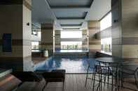 Kolam Renang Nice and Stunning 2BR Loft Apartment at Maqna Residence By Travelio