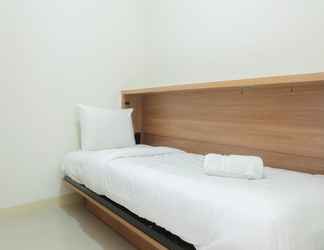 Bedroom 2 Fully Furnished 2BR Green Pramuka Apartment By Travelio