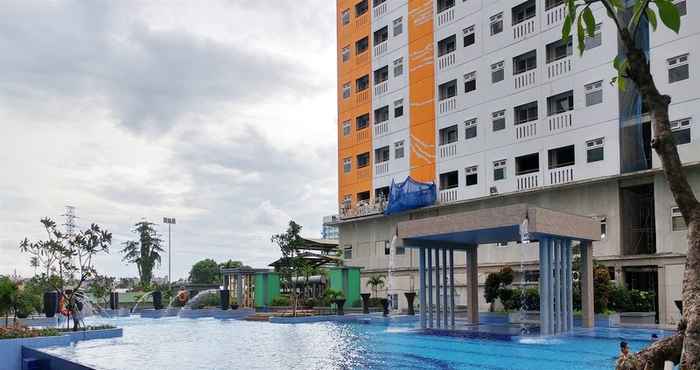 Swimming Pool Fully Furnished 2BR Green Pramuka Apartment By Travelio