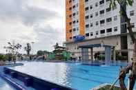 Swimming Pool Fully Furnished 2BR Green Pramuka Apartment By Travelio