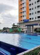 SWIMMING_POOL Fully Furnished 2BR Green Pramuka Apartment By Travelio