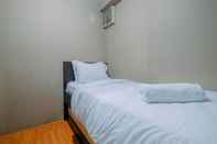 Bedroom Homey and Strategic 2BR at Kalibata City Apartment By Travelio
