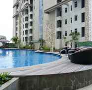 Swimming Pool 2 Comfy and Fully Furnished 1BR Apartment at Vittoria Residence By Travelio