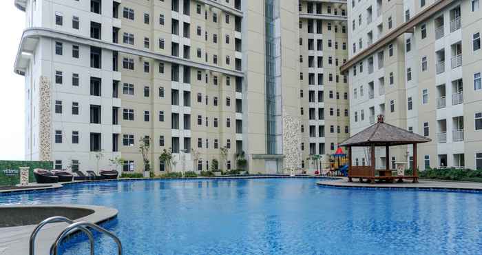 Swimming Pool Comfy and Fully Furnished 1BR Apartment at Vittoria Residence By Travelio