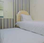Bilik Tidur 4 Comfy 2BR @ Green Palace Kalibata City Apartment By Travelio