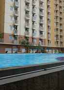 SWIMMING_POOL Comfy 3BR Apartment at Green Palm Residences By Travelio