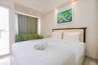 Bedroom Minimalist Studio Apartment at The Oasis Cikarang By Travelio